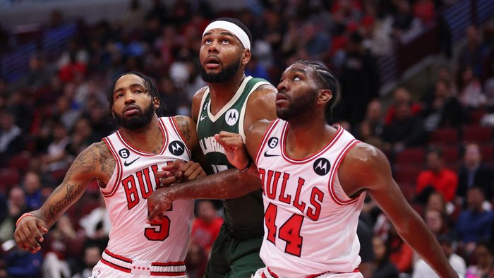 CHICAGO, ILLINOIS - OCTOBER 11: Marques Bolden #15 of the Milwaukee Bucks battles for a rebound with Derrick Jones Jr. #5 and Patrick Williams #44 of the Chicago Bulls during the first half of a preseason game at United Center on October 11, 2022 in Chicago, Illinois. NOTE TO USER: User expressly acknowledges and agrees that, by downloading and or using this photograph, User is consenting to the terms and conditions of the Getty Images License Agreement. (Photo by Michael Reaves/Getty Images)