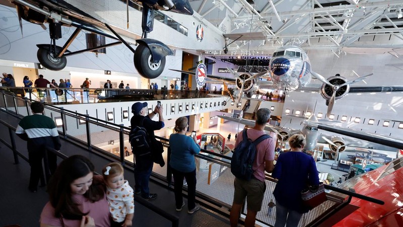 Patrons visit the Smithsonian's National Air and Space Museum for the public reopening of the museum’s west end galleries on the National Mall in Washington, U.S. October 14, 2022. The museum, which before closing for renovations trailed only the Louvre in Paris as the world’s most visited museums, is scheduled to fully reopen when the east end is completed in 2025. REUTERS/Jonathan Ernst