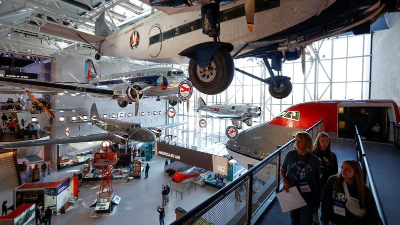 Patrons visit the Smithsonian's National Air and Space Museum for the public reopening of the museum’s west end galleries on the National Mall in Washington, U.S. October 14, 2022. The museum, which before closing for renovations trailed only the Louvre in Paris as the world’s most visited museums, is scheduled to fully reopen when the east end is completed in 2025. REUTERS/Jonathan Ernst