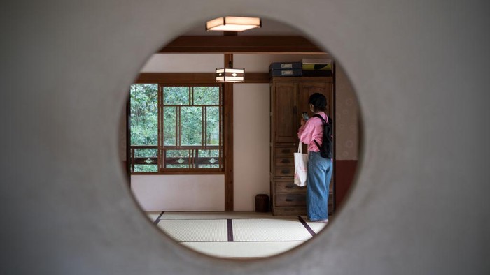 NAGAKUTE, JAPAN - OCTOBER 12: Members of the media look at the interior of a replica of the Satsuki and Meis House from the film My Neighbour Totoro, that is copyrighted by Studio Ghibli, during a preview for the Ghibli Park on October 12, 2022 in Nagakute, Japan. The theme park, which features Studio Ghibli animations, opens on November 1 in the Expo 2005 Aichi Commemorative Park. (Photo by Tomohiro Ohsumi/Getty Images)