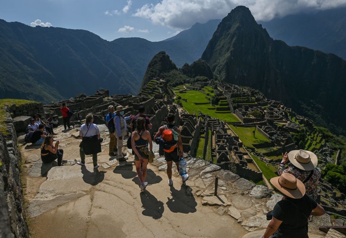 Tourists explore the ancient Inca city of Machu Picchu located in the Andes at an altitude of 2,430 meters (7,970 feet).
The most famous icon of the Inca civilization was declared a Peruvian Historical Sanctuary in 1981, a UNESCO World Heritage Site in 1983, and in 2007 was then declared one of the Seven New Wonders of the World.
On Wednesday, 20 April 2022, in Historic Sanctuary of Machu Picchu, Urubamba Province, Peru. (Photo by Artur Widak/NurPhoto via Getty Images)