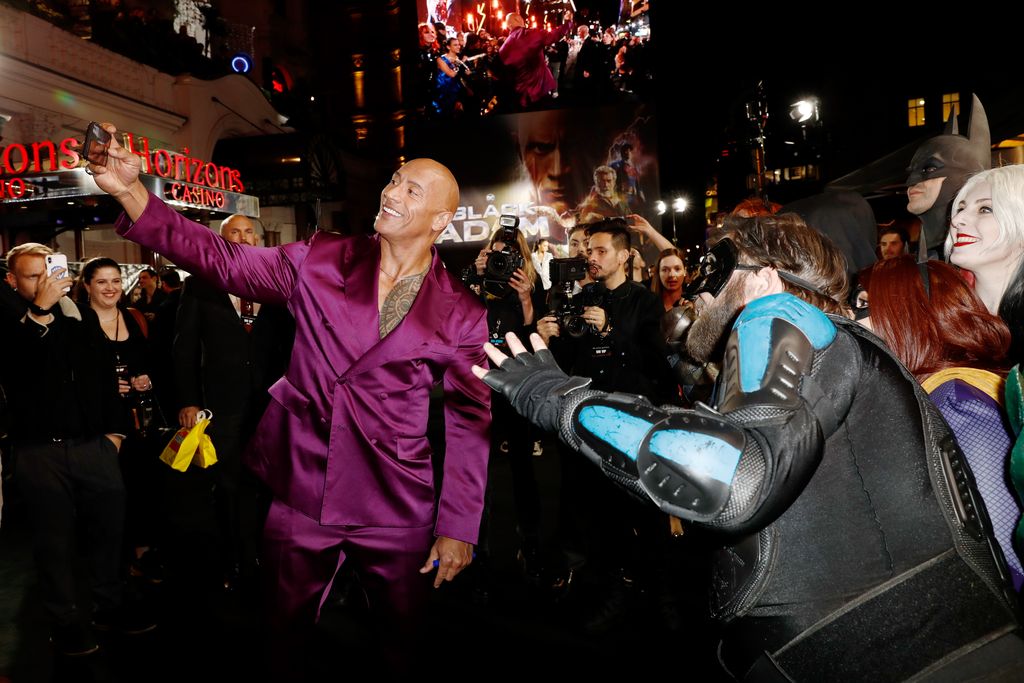 LONDON, ENGLAND - OCTOBER 18: Dwayne Johnson AKA The Rock poses with fans at the UK Premiere of 