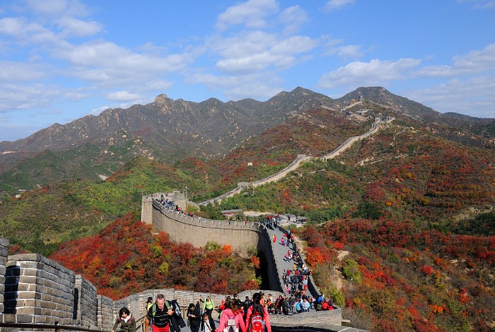 BEIJING, CHINA - OCTOBER 19:  (CHINA OUT) Tourists enjoy autumn views at the Badaling Great Wall on October 19, 2013 in Beijing, China. The red leaves of maple trees are the most charming autumn scenery in Beijing.  (Photo by Visual China Group via Getty Images/Visual China Group via Getty Images)