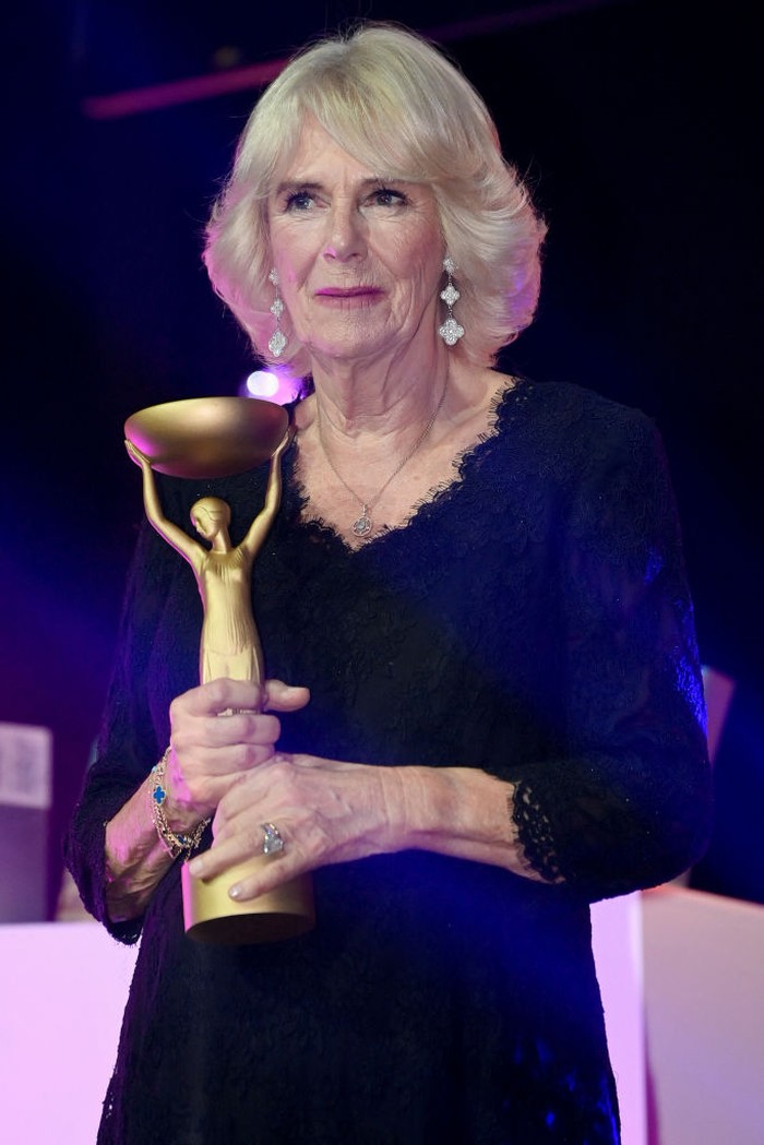 LONDON, ENGLAND - OCTOBER 17: Camilla, Queen Consort presents winner Shehan Karunatilaka for The Seven Moons of Maali Almeida with the Booker Prize for Fiction 2022 award at the Roundhouse, on October 17, 2022, in London, England. (Photo by Toby Melville - WPA Pool/Getty Images)