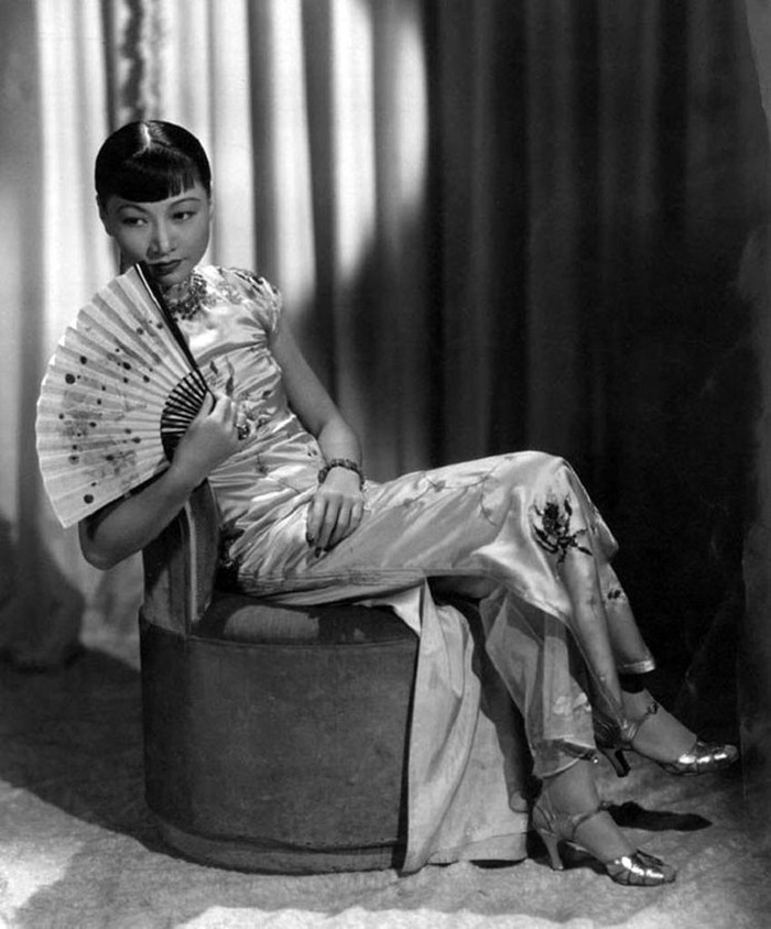 Anna May Wong (January 3, 1905 Ð February 3, 1961) was an American actress, the first Chinese American movie star, and the first Asian American to become an international star. Her long and varied career spanned both silent and sound film, television, stage, and radio. Born near the Chinatown neighborhood of Los Angeles to second-generation Chinese-American parents, Wong became infatuated with the movies and began acting in films at an early age. During the silent film era, she acted in The Toll of the Sea (1922), one of the first movies made in color and Douglas Fairbanks' The Thief of Bagdad (1924). Wong became a fashion icon, and by 1924 had achieved international stardom. Frustrated by the stereotypical supporting roles she reluctantly played in Hollywood, she left for Europe in the late 1920s, where she starred in several notable plays and films, among them Piccadilly (1929). She spent the first half of the 1930s traveling between the United States and Europe for film and stage work. Wong was featured in films of the early sound era, such as Daughter of the Dragon (1931) and Daughter of Shanghai (1937), and with Marlene Dietrich in Josef von Sternberg's Shanghai Express (1932). In 1935 Wong was dealt the most severe disappointment of her career, when Metro-Goldwyn-Mayer refused to consider her for the leading role in its film version of Pearl S. Buck's The Good Earth, choosing instead the German actress Luise Rainer to play the leading role. Wong spent the next year touring China, visiting her family's ancestral village and studying Chinese culture. In the late 1930s, she starred in several B movies for Paramount Pictures, portraying Chinese-Americans in a positive light. She paid less attention to her film career during World War II, when she devoted her time and money to helping the Chinese cause against Japan. Wong returned to the public eye in the 1950s in several television appearances as well as her own series in 1951, The Gallery of Madame Liu-Tsong, the