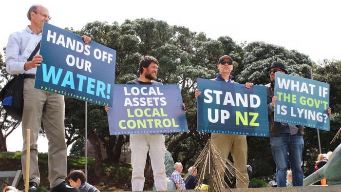1434871128 WELLINGTON, NEW ZEALAND - OCTOBER 20: A placard targeting Jacinda Ardern is held aloft at a Groundswell protest against government regulation and climate change policies on October 20, 2022 in Wellington, New Zealand. The New Zealand government announced plans on 11 October aimed at reducing agricultural emissions, including proposed taxes on farmers. (Photo by Lynn Grieveson/Getty Images)