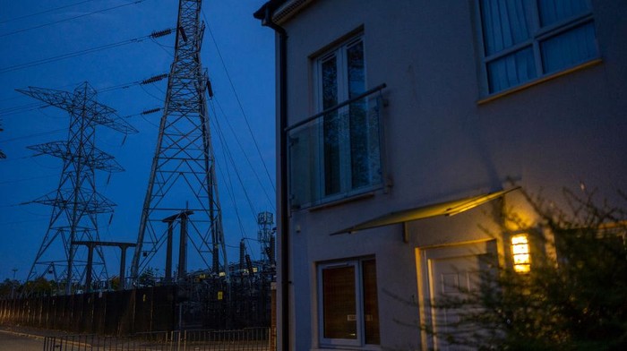 MANCHESTER, ENGLAND - OCTOBER 19: Night time falls behind electricity pylons and a sub station on October 19, 2022 in Manchester, England. The British utility company, National Grid, said this week that UK households may face power cuts this winter for up to three hours at a time, if gas supplies run low. The UK relies heavily on gas to produce electricity, and gas supplies to Europe have been severely disrupted by the fallout from Russias invasion of Ukraine (Photo by Christopher Furlong/Getty Images)