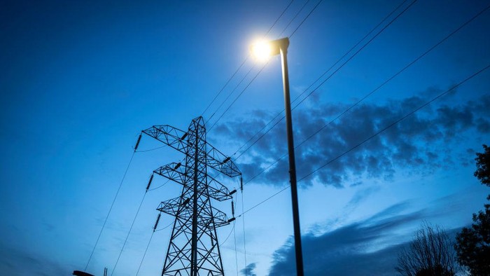 1434975757 MANCHESTER, ENGLAND - OCTOBER 19: Night time falls behind electricity pylons and a sub station on October 19, 2022 in Manchester, England. The British utility company, National Grid, said this week that UK households may face power cuts this winter for up to three hours at a time, if gas supplies run low. The UK relies heavily on gas to produce electricity, and gas supplies to Europe have been severely disrupted by the fallout from Russia's invasion of Ukraine (Photo by Christopher Furlong/Getty Images)