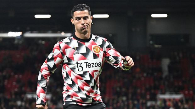 Manchester United's Portuguese striker Cristiano Ronaldo reacts during the warm up prior to the English Premier League football match between Manchester United and Tottenham Hotspur at Old Trafford in Manchester, north west England, on October 19, 2022. - RESTRICTED TO EDITORIAL USE. No use with unauthorized audio, video, data, fixture lists, club/league logos or 'live' services. Online in-match use limited to 120 images. An additional 40 images may be used in extra time. No video emulation. Social media in-match use limited to 120 images. An additional 40 images may be used in extra time. No use in betting publications, games or single club/league/player publications. (Photo by Oli SCARFF / AFP) / RESTRICTED TO EDITORIAL USE. No use with unauthorized audio, video, data, fixture lists, club/league logos or 'live' services. Online in-match use limited to 120 images. An additional 40 images may be used in extra time. No video emulation. Social media in-match use limited to 120 images. An additional 40 images may be used in extra time. No use in betting publications, games or single club/league/player publications. / RESTRICTED TO EDITORIAL USE. No use with unauthorized audio, video, data, fixture lists, club/league logos or 'live' services. Online in-match use limited to 120 images. An additional 40 images may be used in extra time. No video emulation. Social media in-match use limited to 120 images. An additional 40 images may be used in extra time. No use in betting publications, games or single club/league/player publications. (Photo by OLI SCARFF/AFP via Getty Images)