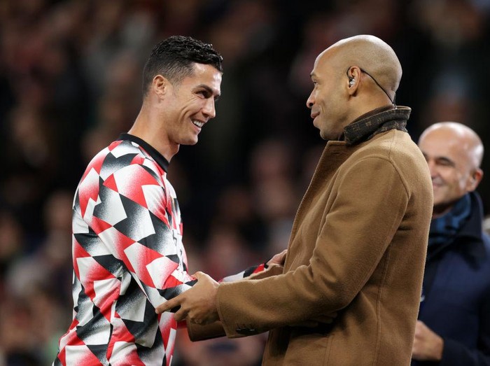 MANCHESTER, ENGLAND - OCTOBER 19: Cristiano Ronaldo of Manchester United interacts with Thierry Henry prior to the Premier League match between Manchester United and Tottenham Hotspur at Old Trafford on October 19, 2022 in Manchester, England. (Photo by Alex Pantling/Getty Images)