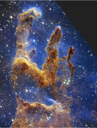 This image released by NASA on Wednesday, Oct. 19, 2022, shows the Pillars of Creation, captured by the James Webb Space Telescope in near-infrared-light view. (NASA, ESA, CSA, STScI via AP)