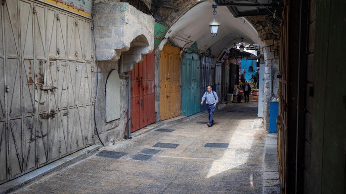 1244099845 JERUSALEM - OCTOBER 20: Shops remain closed as workers launched a general strike to mourn the killing of 22-year-old Palestinian man Udai Tamimi by Israeli forces in Eastern Jerusalem on October 20, 2022. Israeli forces shot dead a Palestinian youth Wednesday who opened fire at a military checkpoint, killing a soldier. The incident occurred after 11 days of extensive combing operations to find Uday Al-Tamimi, 22, in the Shuafat refugee camp in East Jerusalem. (Photo by Eyad Tawil/Anadolu Agency via Getty Images)