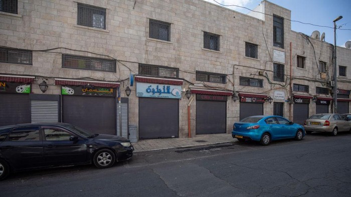 1244099845 JERUSALEM - OCTOBER 20: Shops remain closed as workers launched a general strike to mourn the killing of 22-year-old Palestinian man Udai Tamimi by Israeli forces in Eastern Jerusalem on October 20, 2022. Israeli forces shot dead a Palestinian youth Wednesday who opened fire at a military checkpoint, killing a soldier. The incident occurred after 11 days of extensive combing operations to find Uday Al-Tamimi, 22, in the Shuafat refugee camp in East Jerusalem. (Photo by Eyad Tawil/Anadolu Agency via Getty Images)