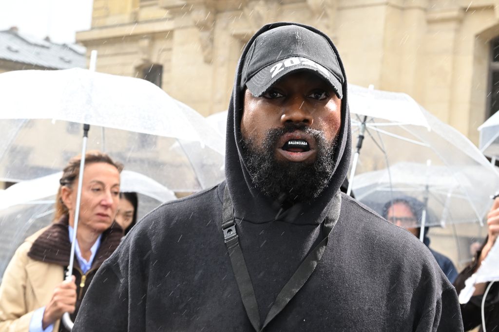PARIS, FRANCE - OCTOBER 02: (EDITORIAL USE ONLY - For Non-Editorial use please seek approval from Fashion House) Kanye West attends the Givenchy Womenswear Spring/Summer 2023 show as part of Paris Fashion Week  on October 02, 2022 in Paris, France. (Photo by Stephane Cardinale - Corbis/Corbis via Getty Images)