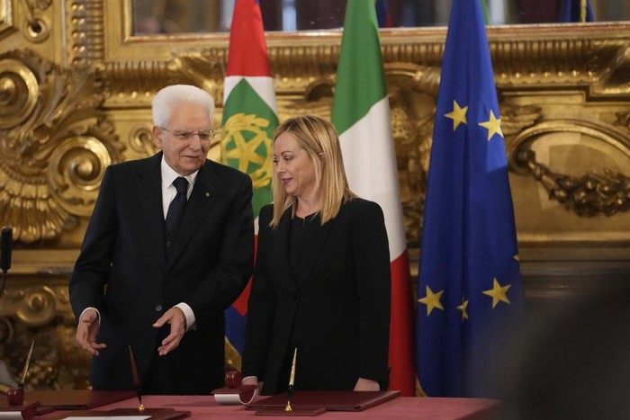 Italian President Sergio Mattarella is flanked by newly appointed Italian Premier Giorgia Meloni during the swearing in ceremony at Quirinal presidential palace in Rome, Saturday, Oct. 22, 2022, as Italys first far-right-led government since the end of World War II takes office. (AP Photo/Alessandra Tarantino)