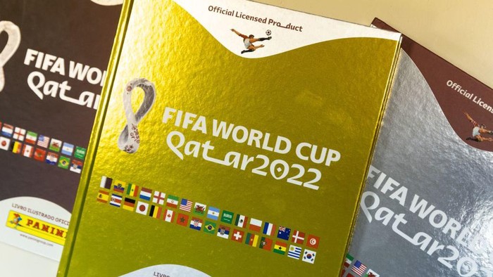 SAO PAULO, BRAZIL - OCTOBER 19: An employee cuts sheets of stickers on the production line of FIFA World Cup Qatar 2022 stickers album at Panini factory on October 19, 2022 in Sao Paulo, Brazil. (Photo by Alexandre Schneider/Getty Images)