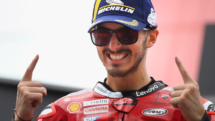 SPIELBERG, AUSTRIA - AUGUST 21:  Francesco Bagnaia of Italy and Ducati Lenovo Team celebrates the victory on the podium during the MotoGP race during the MotoGP of Austria - Race at Red Bull Ring on August 21, 2022 in Spielberg, Austria. (Photo by Mirco Lazzari gp/Getty Images)