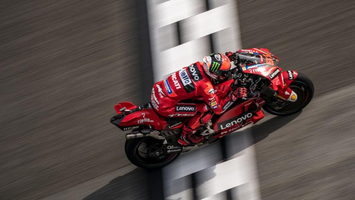 PHILLIP ISLAND, AUSTRALIA - OCTOBER 16:  Francesco Bagnaia of Italy and Ducati Lenovo Team celebrates the third place on the podium during the MotoGP race during the MotoGP of Australia at Phillip Island Grand Prix Circuit on October 16, 2022 in Phillip Island, Australia. (Photo by Mirco Lazzari gp/Getty Images)