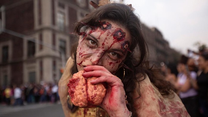 People dressed as zombies take part in the annual Zombie Walk in Mexico City, Mexico October 22, 2022. REUTERS/Quetzalli Nicte-Ha