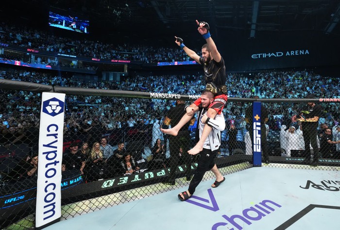 ABU DHABI, UNITED ARAB EMIRATES - OCTOBER 22: Islam Makhachev of Russia celebrates after his victory over Charles Oliveira of Brazil in their UFC lightweight championship fight during the UFC 280 event at Etihad Arena on October 22, 2022 in Abu Dhabi, United Arab Emirates. (Photo by Chris Unger/Zuffa LLC)