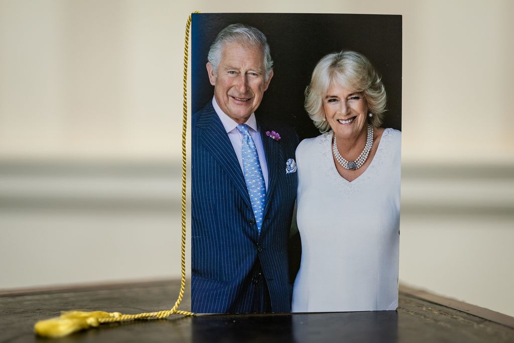 LONDON, ENGLAND - OCTOBER 23: A close-up of the front of one of the first birthday cards celebrating 100 years of age, which have been signed by King Charles III and Camilla, Queen Consort at Buckingham Palace on October 23, 2022 in London, England. The posting of messages to mark significant birthdays and anniversaries is a tradition that dates back to 1917 and the reign of King George V, when those celebrating their 100th birthday or 60th wedding anniversary were sent a telegram of good wishes from His Majesty. Thousands of birthday and wedding anniversary cards are sent from Buckingham Palace every year to those celebrating their 100th and 105th birthday and every year thereafter, and to those celebrating their 60th , 65th, 70th wedding anniversaries and every year thereafter. During Queen Elizabeth II's reign, approximately 1.3 million cards were sent to mark birthdays and anniversaries across the UK, the Realms and the Overseas Territories. The photograph of The King and The Queen Consort that appears on the birthday cards was taken in the summer of 2018.  (Photo by Aaron Chown-WPA Pool/Getty Images)