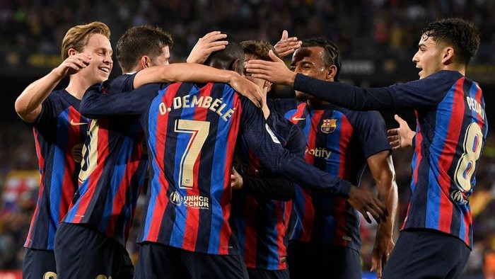 Barcelonas French forward Ousmane Dembele celebrates with teammates scoring his teams first goal during the Spanish league football match between FC Barcelona and Athletic Club Bilbao at the Camp Nou stadium in Barcelona, on October 23, 2022. (Photo by Josep LAGO / AFP) (Photo by JOSEP LAGO/AFP via Getty Images)