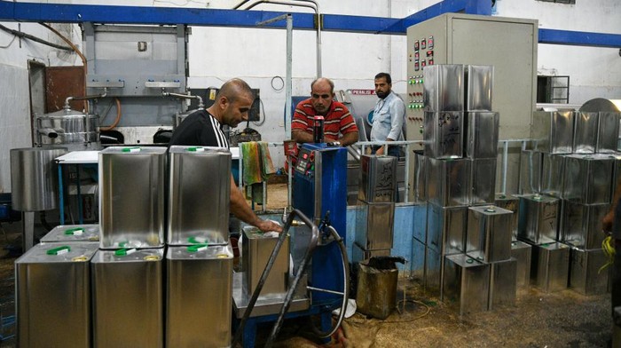 Kurdish farmers press this year's olive crop to extract olive oil coming from the villages of Afrin countryside in northwestern Syria, where Afrin is famous in Aleppo countryside for the best olive oil in the world and is exported from it to Europe, the Gulf states and Turkey, on october 23, 2022. (Photo by Rami Alsayed/NurPhoto via Getty Images)