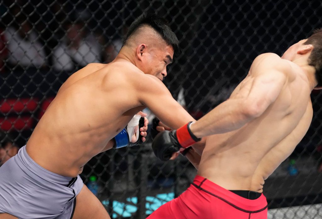 ABU DHABI, UNITED ARAB EMIRATES - OCTOBER 23: (L-R) Jeka Saragih of Indonesia knocks out WonBin Ki of South Korea in a lightweight fight during the Road to UFC event at Etihad Arena on October 23, 2022 in Abu Dhabi, United Arab Emirates. (Photo by Chris Unger/Zuffa LLC)