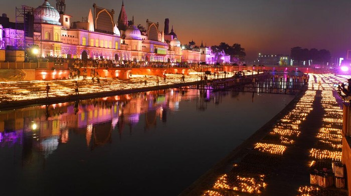 People light lamps on the banks of the river Saryu in Ayodhya, India, Sunday, Oct. 23, 2022. Over 15,00,000 earthen lamps were lit along the banks of the Saryu River, as millions of people across Asia celebrate Diwali, the Hindu festival of lights. (AP Photo/Rajesh Kumar Singh)