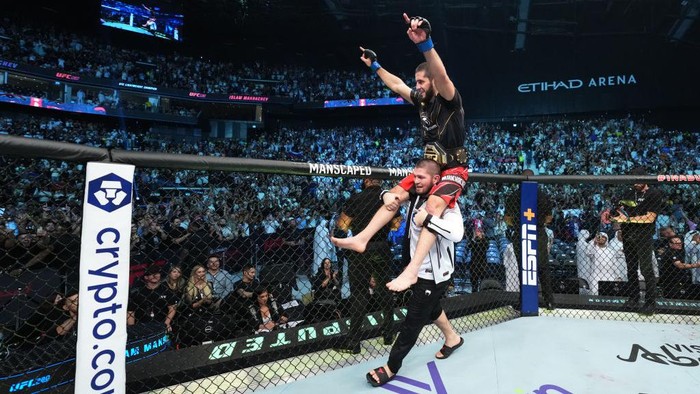 ABU DHABI, UNITED ARAB EMIRATES - OCTOBER 22: Islam Makhachev of Russia celebrates after his victory over Charles Oliveira of Brazil in their UFC lightweight championship fight during the UFC 280 event at Etihad Arena on October 22, 2022 in Abu Dhabi, United Arab Emirates. (Photo by Chris Unger/Zuffa LLC)