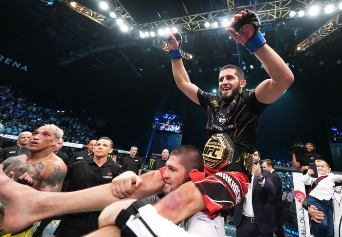 ABU DHABI, UNITED ARAB EMIRATES - OCTOBER 22: Islam Makhachev of Russia celebrates after his victory over Charles Oliveira of Brazil in their UFC lightweight championship fight during the UFC 280 event at Etihad Arena on October 22, 2022 in Abu Dhabi, United Arab Emirates. (Photo by Chris Unger/Zuffa LLC)