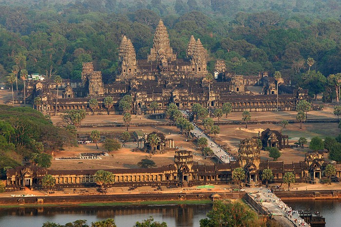 Siem Reap, CAMBODIA: An aerial view of the Angkor Wat temple in Siem Reap province some 314 kilometers northwest of Phnom Penh, 02 March 2007.  Angkor is at the very heart of Cambodias identity, and with nearly two million tourists coming to the country in 2006 -- more than half of those visiting Angkor -- it is recognising the need to keep these precious ruins intact. Some 500 years after a failing irrigation system forced Angkors rulers to abandon the sprawling Khmer capital, a lack of water is again threatening Cambodias most famous temple complex. AFP PHOTO/ TANG CHHIN SOTHY (Photo credit should read TANG CHHIN SOTHY/AFP via Getty Images)