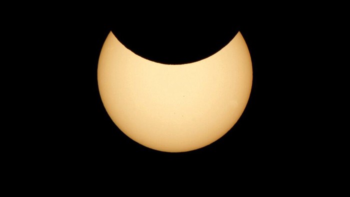A partial solar eclipse is seen from Gaza city, Tuesday, Oct. 25, 2022. (AP Photo/Hatem Moussa)