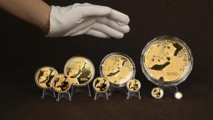BEIJING, CHINA - OCTOBER 25: In this photo illustration, panda commemorative coins are displayed on October 25, 2022 in Beijing, China. The People's Bank of China (PBOC) will issue a set of gold and silver coins featuring giant pandas on October 26. (Photo by VCG/VCG via Getty Images)