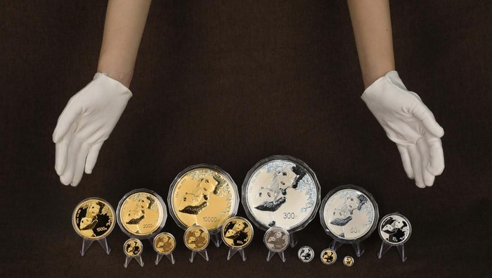 BEIJING, CHINA - OCTOBER 25: In this photo illustration, panda commemorative coins are displayed on October 25, 2022 in Beijing, China. The People's Bank of China (PBOC) will issue a set of gold and silver coins featuring giant pandas on October 26. (Photo by VCG/VCG via Getty Images)