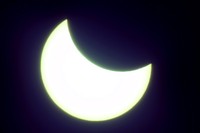 The moon covering part of the sun, during a partial solar eclipse at the monument of Soviet Marshal Georgy Zhukov in Moscow, Russia, Tuesday, Oct. 25, 2022. (AP Photo/Victor Berezkin)