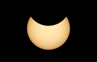 The moon covering part of the sun, during a partial solar eclipse at the monument of Soviet Marshal Georgy Zhukov in Moscow, Russia, Tuesday, Oct. 25, 2022. (AP Photo/Victor Berezkin)