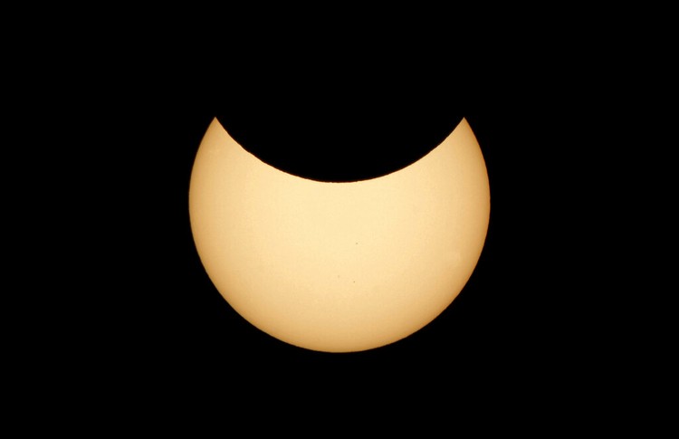 Russia Solar Eclipse The moon covering part of the sun, during a partial solar eclipse at the monument of Soviet Marshal Georgy Zhukov in Moscow, Russia, Tuesday, Oct. 25, 2022. (AP Photo/Victor Berezkin)