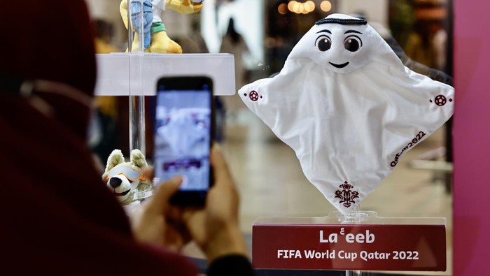 DOHA, QATAR - OCTOBER 24: People take photos of the mascots as the FIFA World Cup mascots owned by the Qatari collector, Mohammed Abdullateef, are being displayed at the City Center shopping mall in Doha, Qatar on October 24, 2022. (Photo by Mohammed Dabbous/Anadolu Agency via Getty Images)