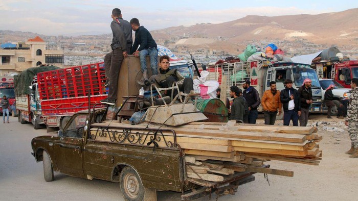 Syrians refugees prepare to leave Lebanon towards Syrian territory through the Wadi Hamid crossing in Arsal on October 26, 2022. - A first batch of Syrian refugees left Lebanon today for their home country, an AFP photographer said, the first step in a new repatriation plan slammed by rights groups. (Photo by AFP) (Photo by -/AFP via Getty Images)