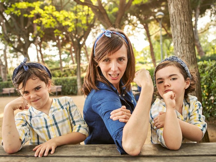 Strong mom flexing her arms - Girl power