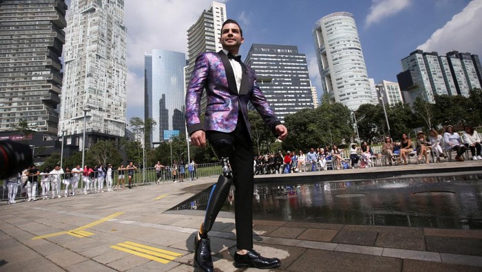Models present creations by Mexican designers during a catwalk show promoting diversity and inclusion to foster acceptance and removal of barriers that disabled people face in the country, in Mexico City, Mexico October 26, 2022. REUTERS/Quetzalli Nicte-Ha .