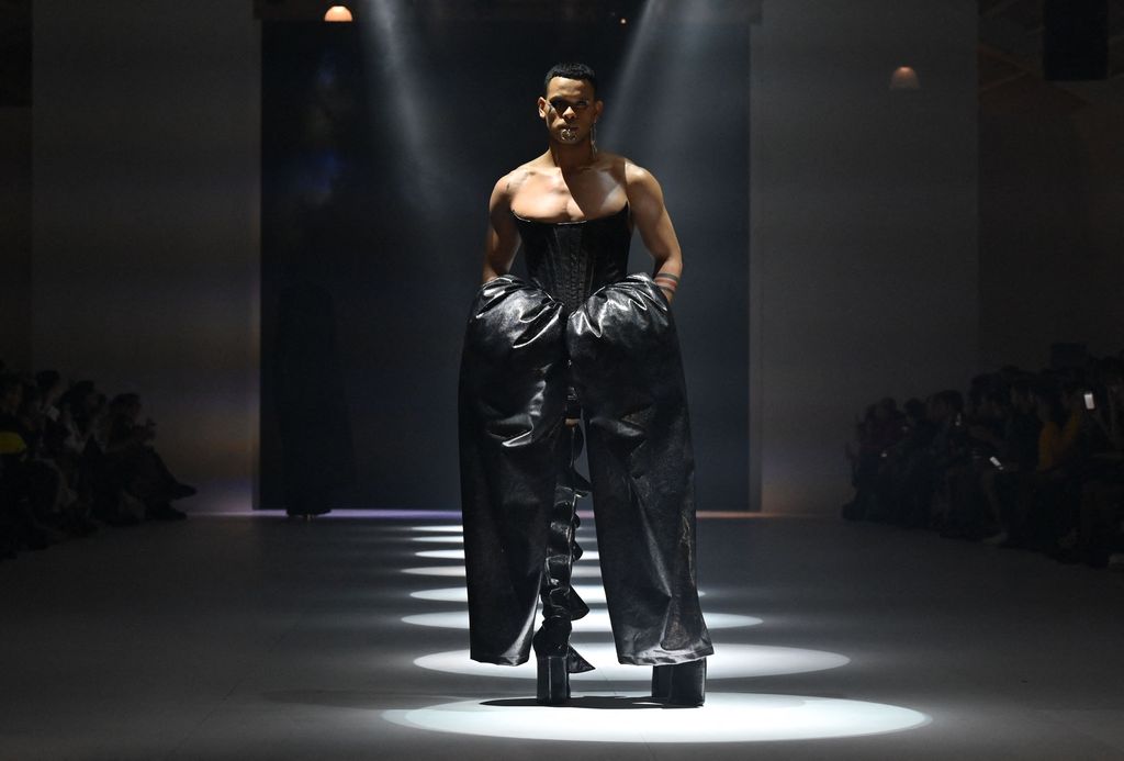 This picture taken in Jakarta on October 27, 2022 shows a model presenting a creation by Harry Halim during 2023 Jakarta Fashion Week in Jakarta. (Photo by ADEK BERRY / AFP) (Photo by ADEK BERRY/AFP via Getty Images)