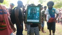 Tampak foto Filep Karma dengan senyumnya yang  khas. Foto: Jonh Roy Purba/detikcom