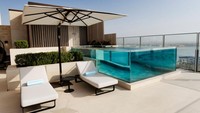 Berlokasi di Dubai, Uni Emirat Arab, pemandangan dari Atlantis The Royal Hotel begitu memukau saat matahari terbenam.