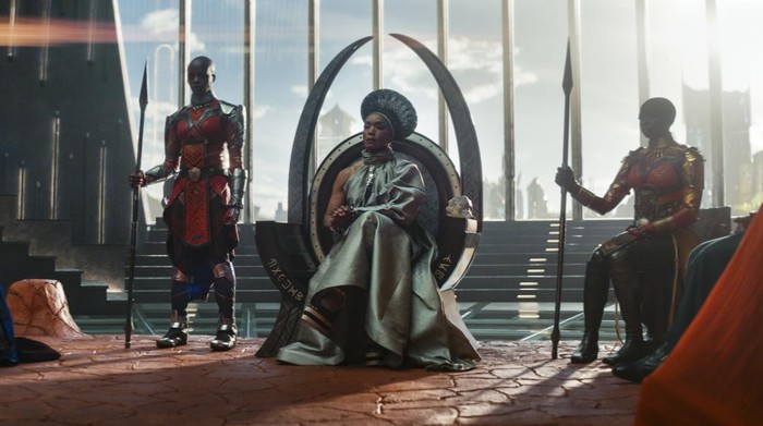 (L-R): Dorothy Steel as Merchant Tribe Elder, Florence Kasumba as Ayo, Angela Bassett as Ramonda, Danai Gurira as Okoye in Marvel Studios Black Panther: Wakanda Forever. Photo courtesy of Marvel Studios. © 2022 MARVEL.