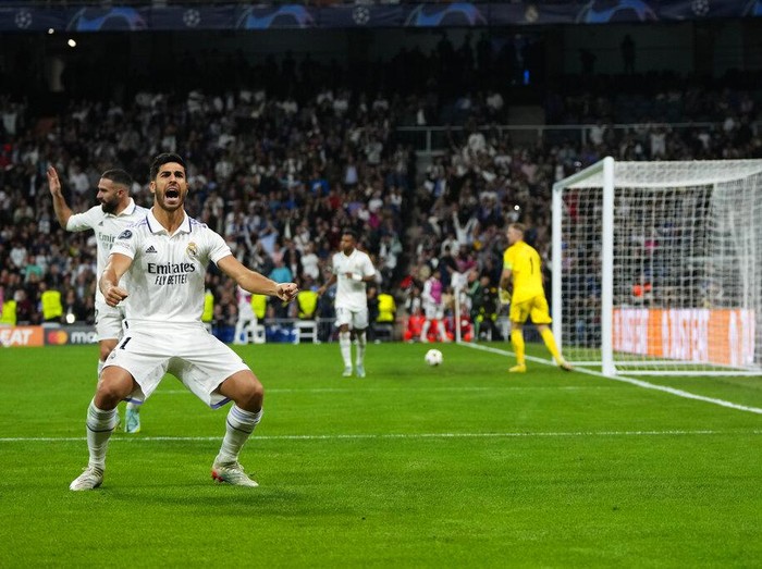 Real Madrid's Marco Asensio celebrates after scoring his side's third goal during the Champions League Group F soccer match between Real Madrid and Celtic at the Santiago Bernabeu stadium in Madrid, Spain, Wednesday, Nov. 2, 2022. (AP Photo/Manu Fernandez)