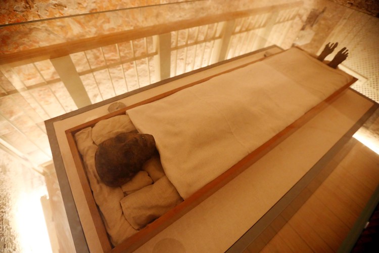 LUXOR, EGYPT - NOVEMBER 04: The mummy of King Tutankhamun displayed as Egypt marks the 100th anniversary of its discovery, in the Valley of the Kings in Luxor, Egypt, 04 November 2022. Egypt is celebrating the 100th anniversary of the discovery of the 3,000-year-old tomb of the Golden King Tutankhamun that was made on 04 November 1922 by British archaeologist Howard Carter. The tomb of King Tut, also known as KV62, was almost the only discovered tomb not breached by grave robbers in the Valley of the Kings with more than 5,000 pieces, most of them were gold, including his funerary mask, gold sandals, an outer gold-gilded wooden coffin and innermost coffin of solid gold. Tutankhamuns mummy and sarcophagus are still on display in the tomb, while many of the funerary objects discovered were displayed at the Egyptian Museum in Tahrir Square and will be transferred to the new Grand Egyptian Museum in Giza when it opens. (Photo by Fareed Kotb/Anadolu Agency via Getty Images)