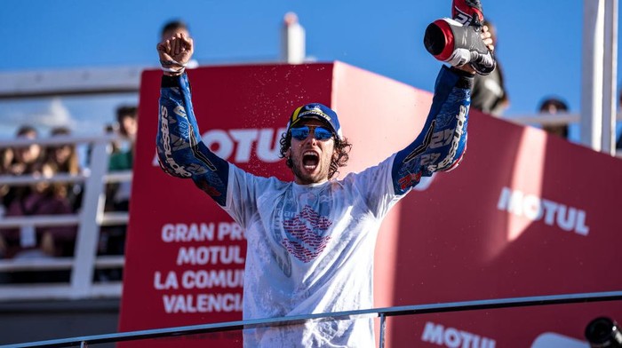 VALENCIA, SPAIN - NOVEMBER 06: Alex Rins of Spain and Team SUZUKI ECSTAR after his race win on the podium during the race of the MotoGP Gran Premio Motul de la Comunitat Valenciana at Ricardo Tormo Circuit on November 06, 2022 in Valencia, Spain. (Photo by Steve Wobser/Getty Images)