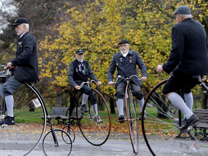 Participants wearing historical costumes ride their high-wheel bicycles during the annual penny farthing race in Prague, Czech Republic, November 5, 2022. REUTERS/David W Cerny